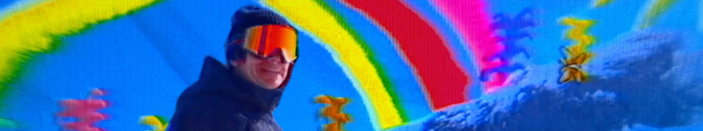 A person in winter gear and reflective goggles stands in snow, with a vivid, colorful background of rainbows and abstract shapes.