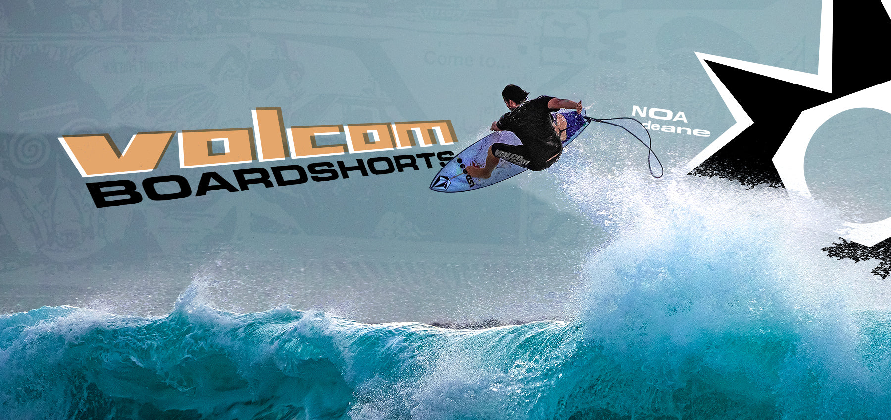 Surfer riding a wave with Volcom Boardshorts logo in the background