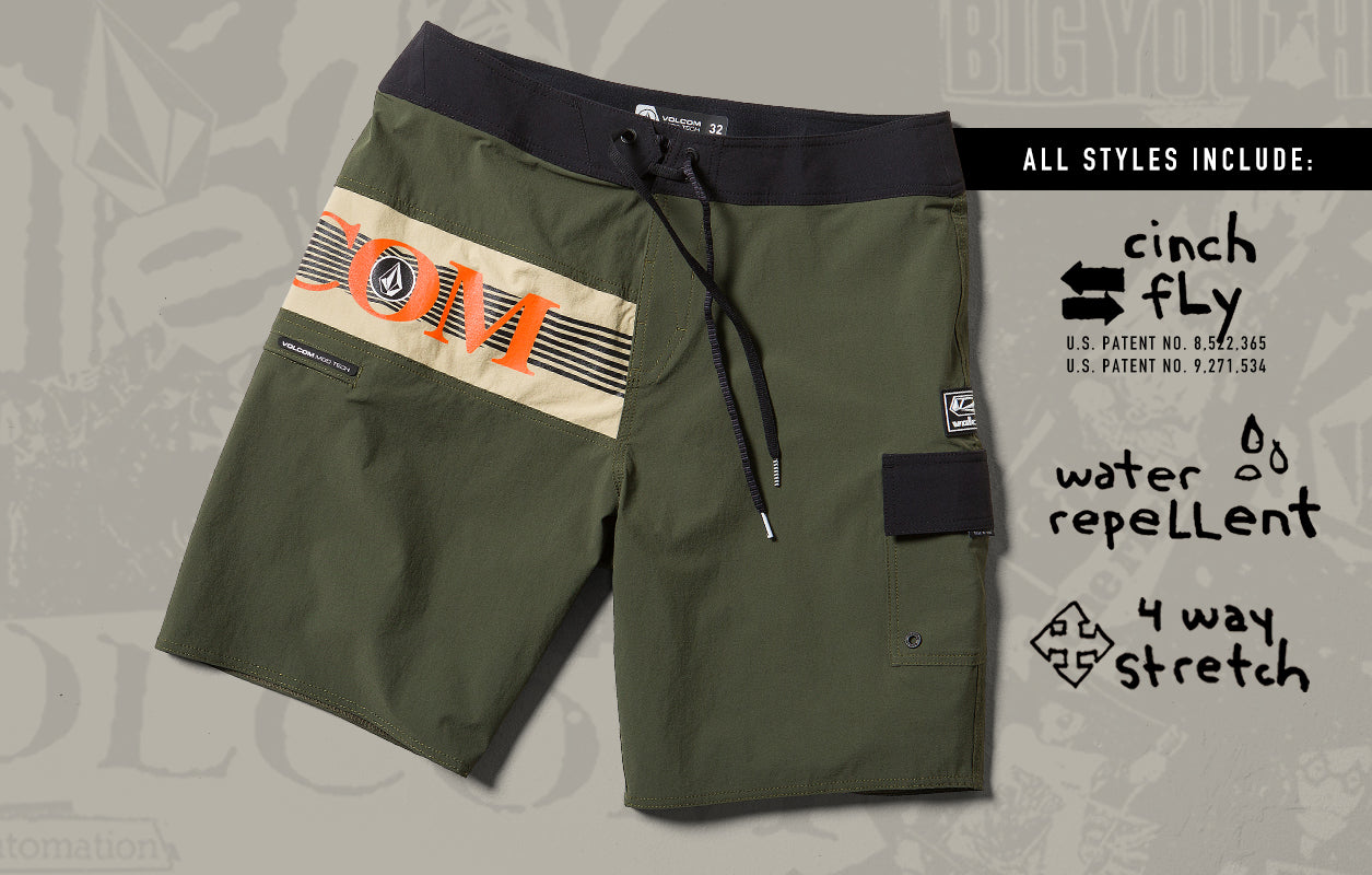 Green shorts with a brand logo on a gray background