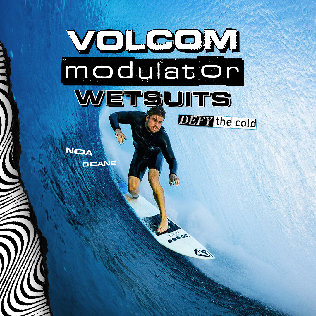 Surfer in a wetsuit riding a wave with Volcom modulator wetsuits branding.
