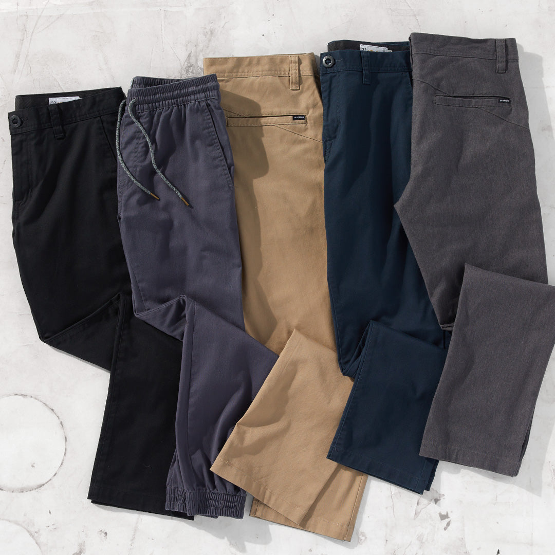 Pairs of different colored pants on a white background