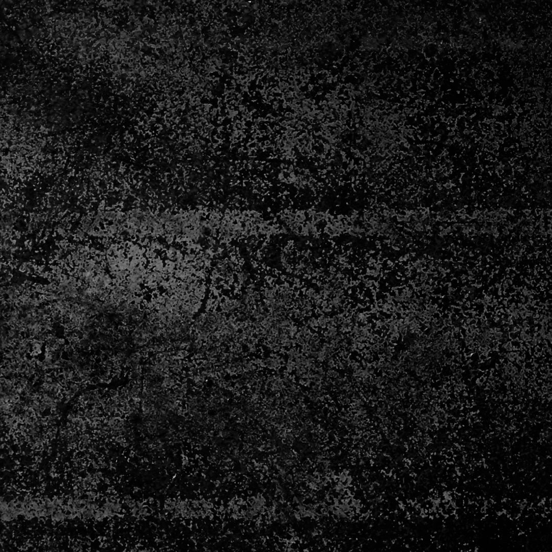 A dark, textured surface with a distressed grunge pattern in black and charcoal gray.