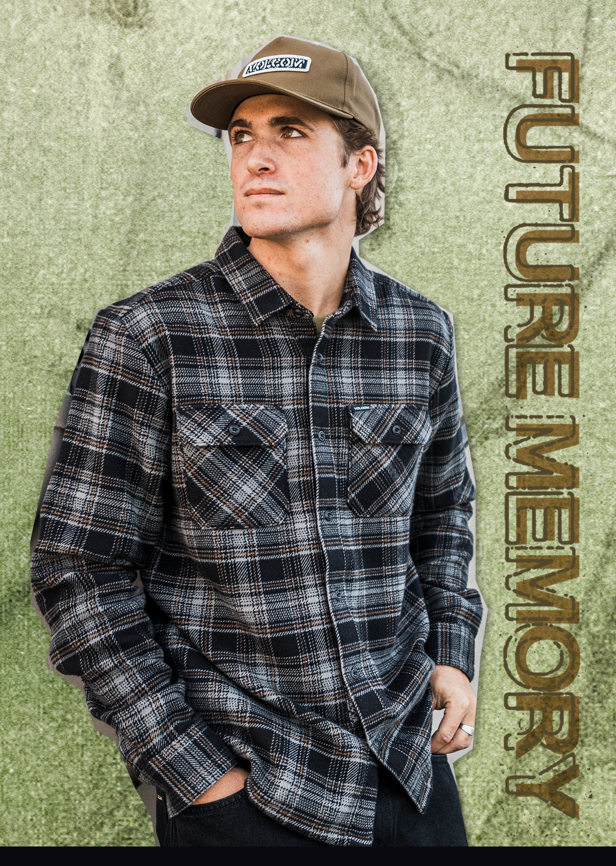 A man wearing a dark gray and black plaid button-down shirt with a brown cap, posed against a textured olive green background with vertical text reading 'FUTURE MEMORY'.