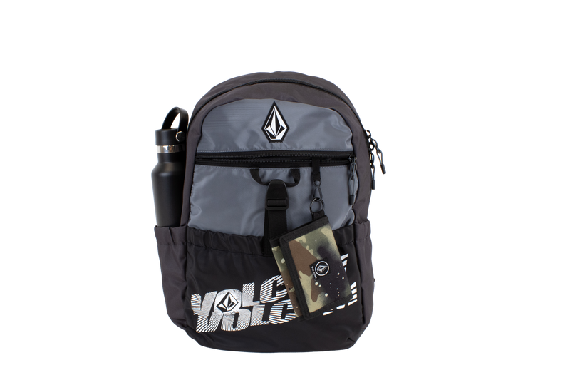 The Volcom Men's Summer School backpack features a sleek black and gray design with the brand’s logo and signature Stone printed on the front. It includes a front zipper pocket, a dedicated laptop sleeve, and side pocket that holds a black water bottle. A camo wallet is attached to the zipper. Lightweight and practical, this Volcom Men’s Summer School backpack makes the perfect choice for your summer school essentials.