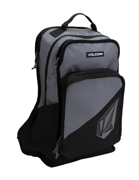 The Men's Boundary Backpack by Volcom is a gray and black bag featuring two front zippered compartments, a top handle, and the Volcom logo on the lower pocket.
