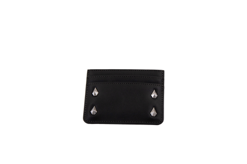 A Volcom Women's Studette Card Wallet in black, featuring a slim design with three card slots and four silver pyramid studs—two on each side—displayed against a plain white background.