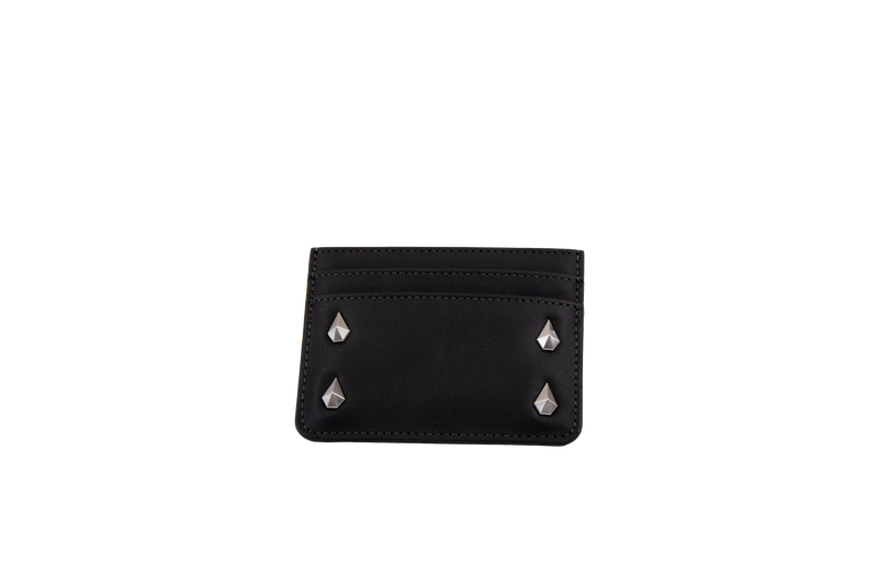 A Volcom Women's Studette Card Wallet in black, featuring a slim design with three card slots and four silver pyramid studs—two on each side—displayed against a plain white background.