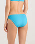 A person wearing the Volcom Women's Simply Rib Hipster Full bikini bottom in bright blue, shown from the back against a neutral background.