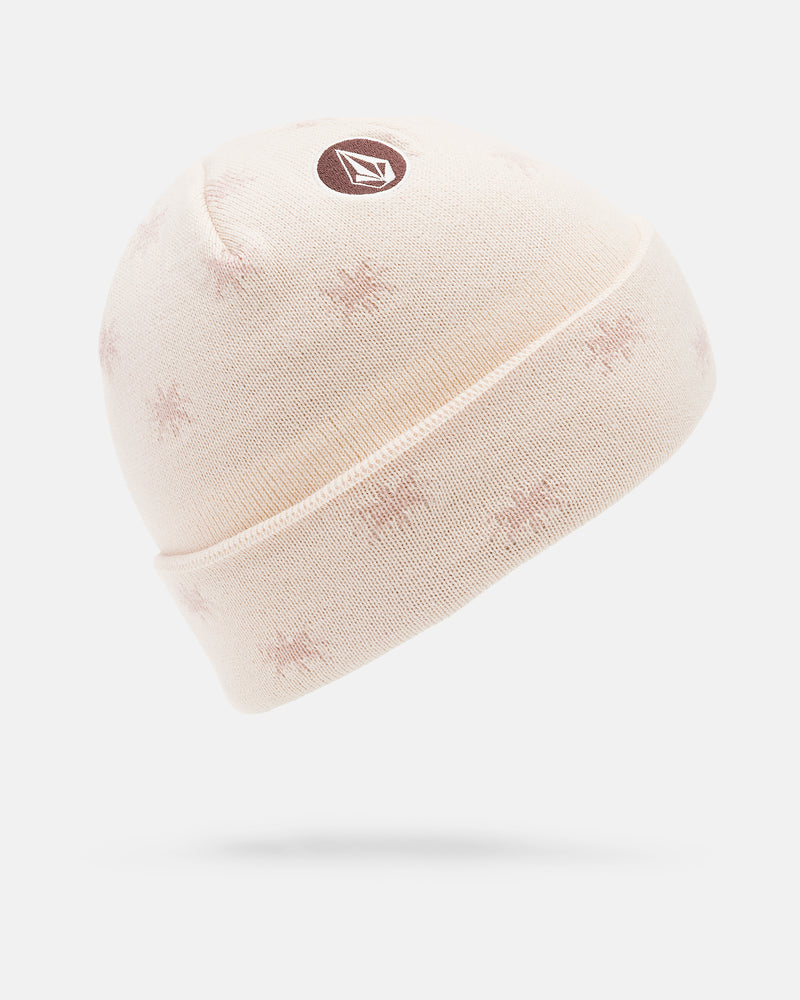 The Women’s Printy Rad Beanie by Volcom features a light pink acrylic knit, subtle jacquard star patterns, and a circular Volcom logo patch on the front. Displayed on a white background.