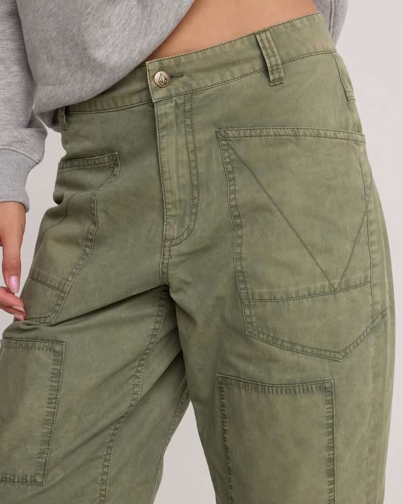 Volcom Women’s Patchwork Pants in olive green with a utility-cool design featuring large patch pockets on the front.
