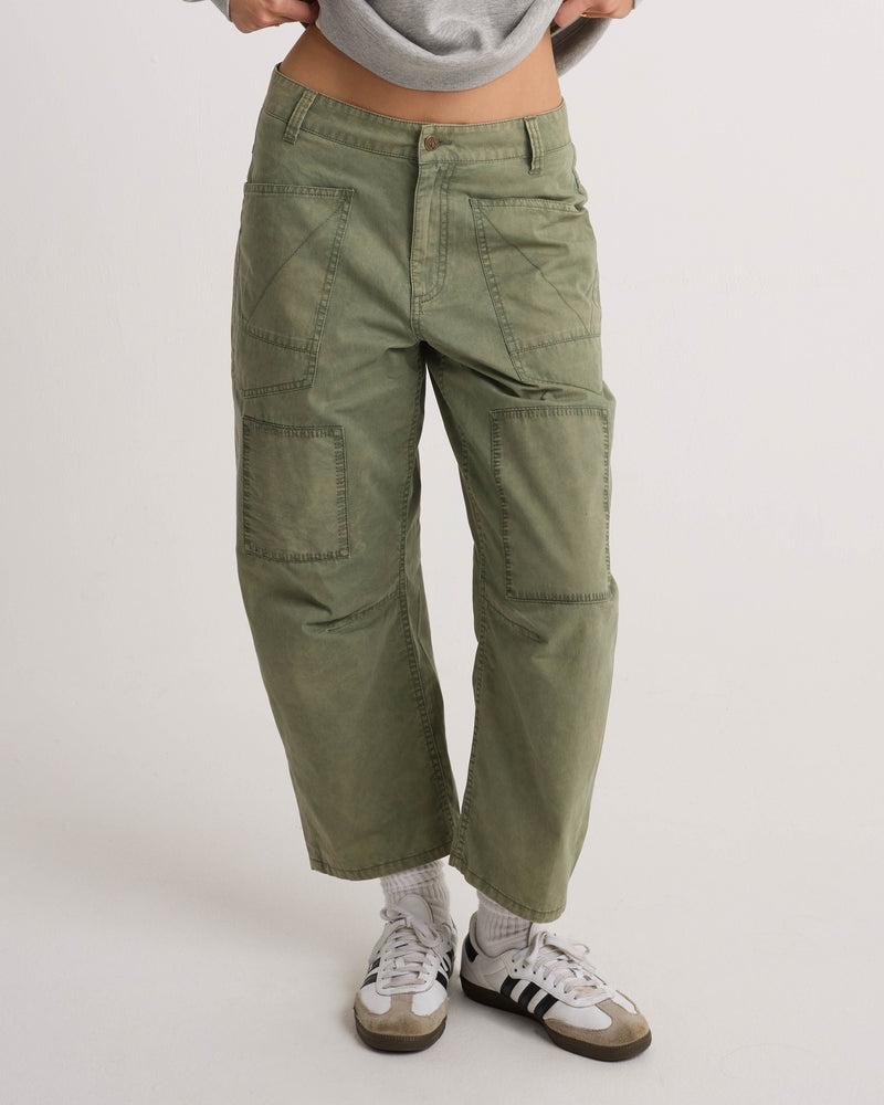 Volcom Women’s Patchwork Pants in olive green, featuring a utility-cool, wide-leg silhouette with decorative detailing on the front thighs.