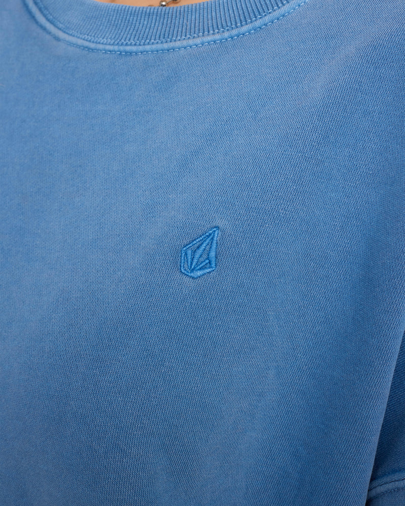 Volcom Women’s Stone Soft Crew blue washed fleece sweatshirt featuring a relaxed dropped-shoulder fit and a small, tonal diamond-shaped logo embroidered on the chest.
