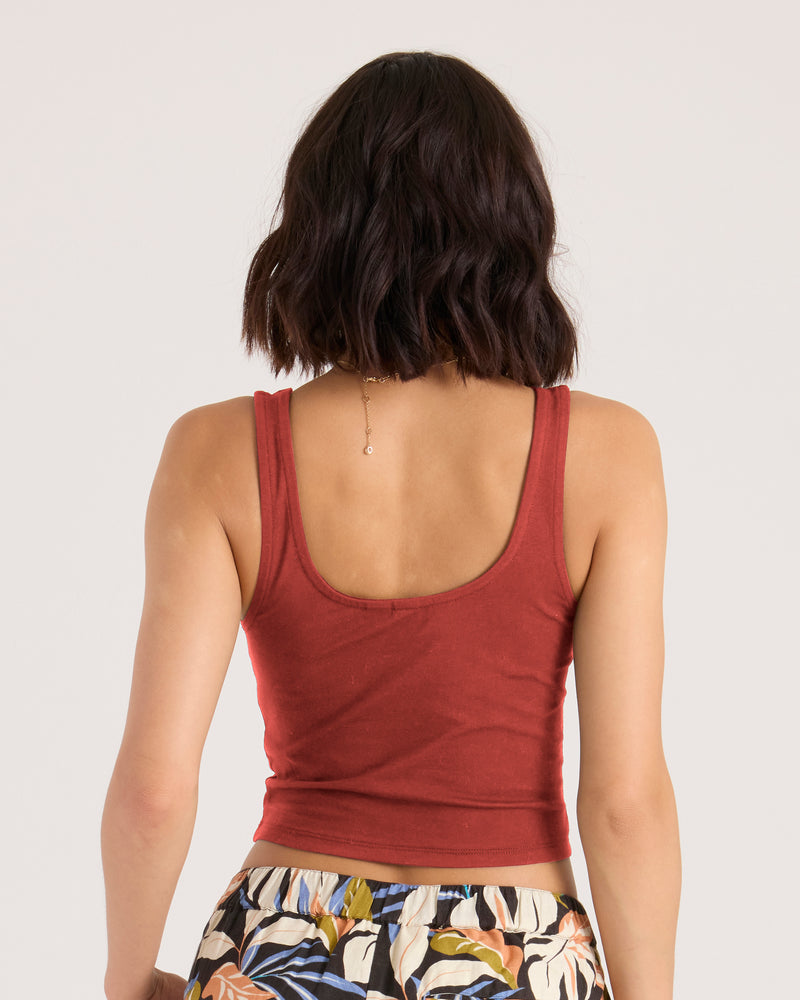 Back view of a person wearing a fitted Marsala Women’s Hot Corset Tank with a scoop neckline and patterned shorts.