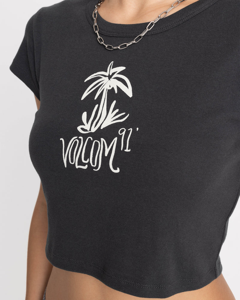 Charcoal grey Women’s Volcom Doodle 1991 Mid Tee with a cropped, boxy fit and a white palm tree graphic above the text Volcom 91.