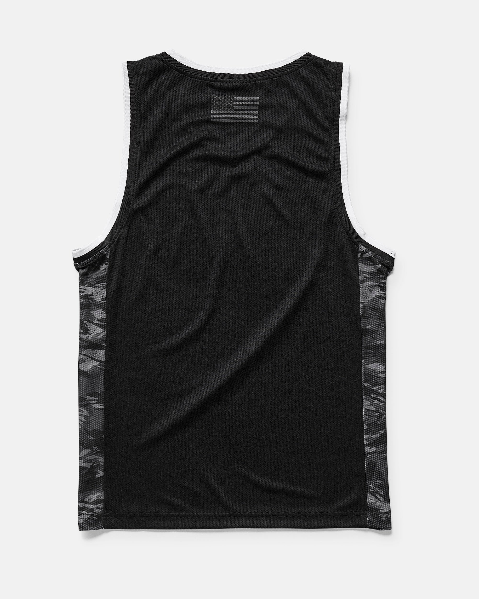 The Men's Froth Of July Tank by Volcom is shown from the back, featuring a small black-and-gray American flag at the upper back, dark camo side panels with closed-cell mesh, and white trim on the neckline and armholes.