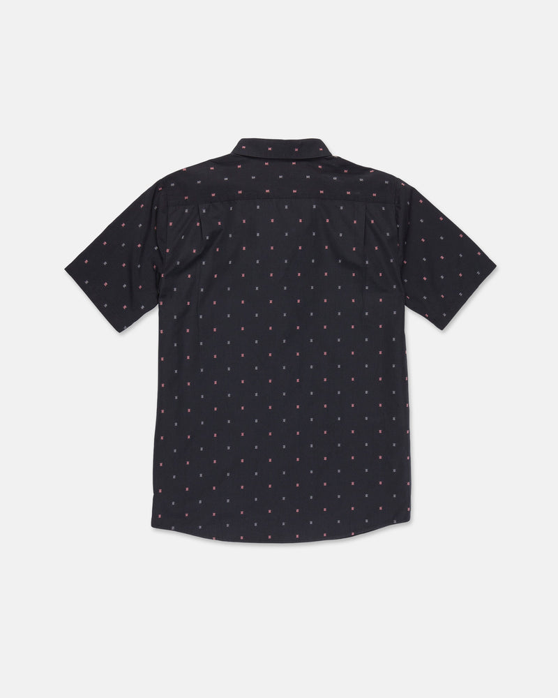 The Volcom Men's Bankstone Short Sleeve Shirt is featured in black with a subtle red and white dotted pattern, displayed from the back against a plain white background. This classic fit button-up is crafted from a comfortable cotton-poly blend, making it ideal for versatile, everyday wear.