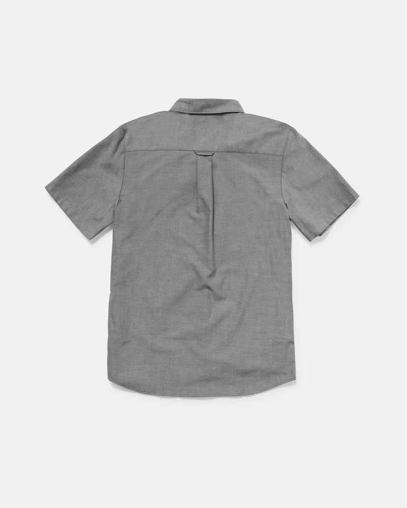 Back view of the Volcom Men's Everett Oxford II short sleeve, light gray button-up shirt with a collar and center back pleat. The classic fit oxford is laid flat on a white background.