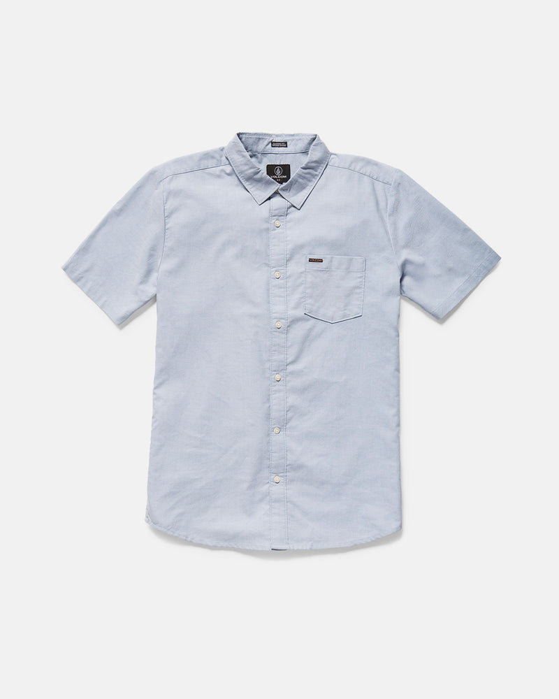 The Volcom Men's Everett Oxford II Shirt in light blue features a classic fit, collar, front chest pocket with a small logo tag, and is displayed laid flat on a white background.