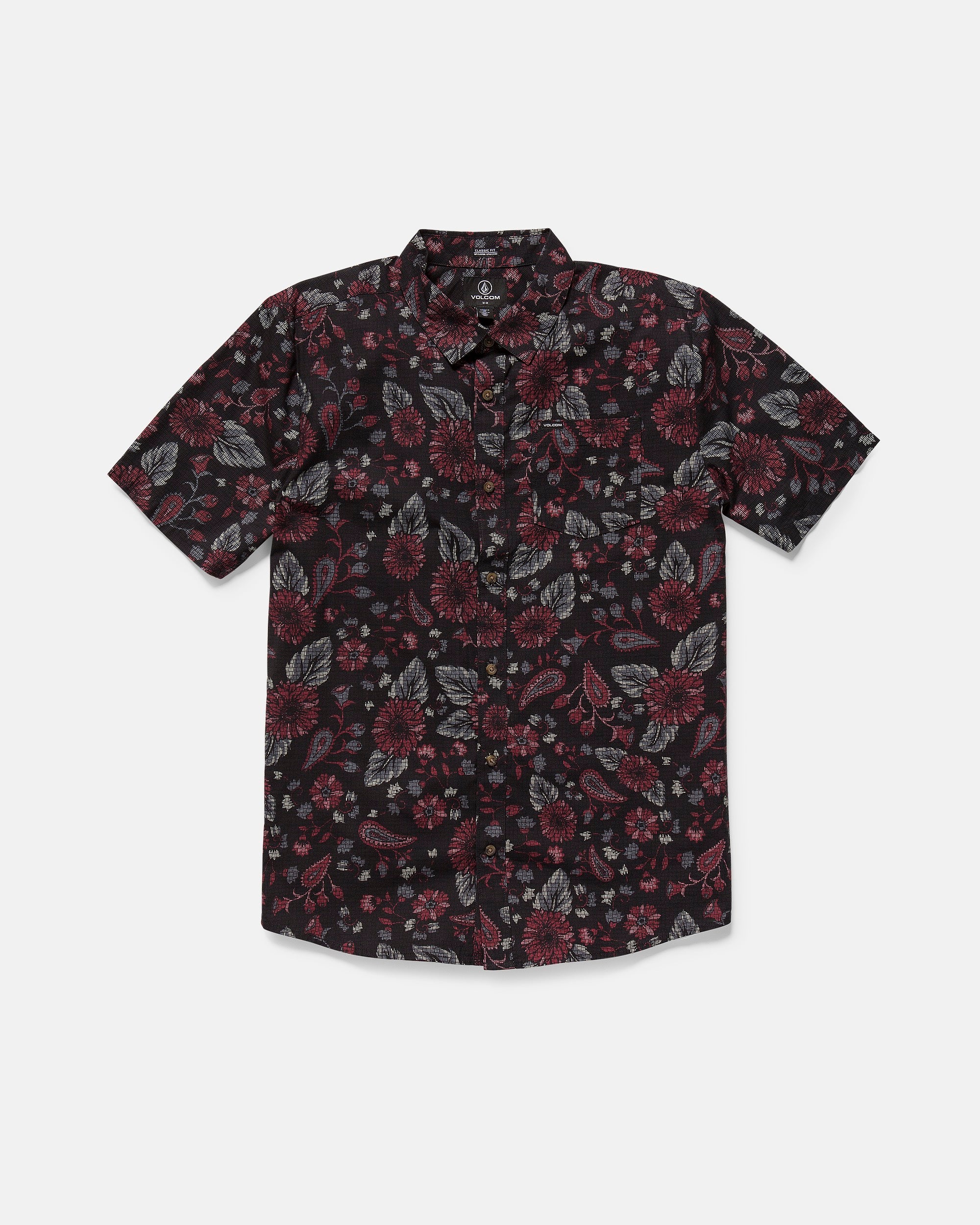 The Volcom Men's Scaler Stone Woven Short Sleeve Shirt features a dark base with red, gray, and white floral prints, classic fit, collar, button-up front, and a left chest pocket.