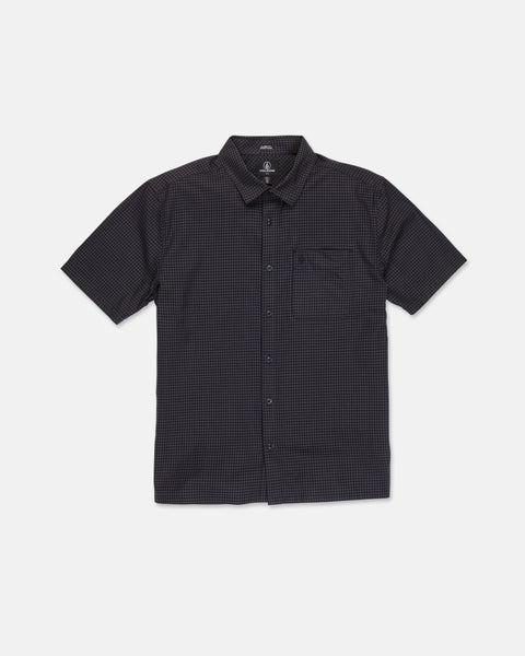 The Volcom Men's Glasnow Short Sleeve Shirt, shown laid flat on a white background, features a black cotton fabric with a subtle small yarn-dyed checkered pattern, button-up front, flat collar, and chest pocket.