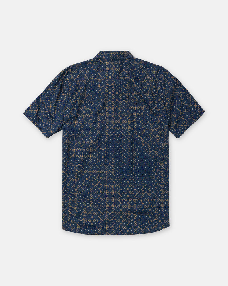 Back view of the navy blue Men’s Scaler Stone Short Sleeve, featuring an all-over repeating geometric diamond and dot pattern.