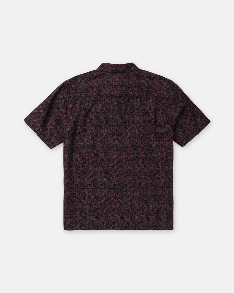 Back view of the dark purple Men’s Branton Short Sleeve, a boxy fit collared shirt featuring an allover repeating geometric circle pattern.