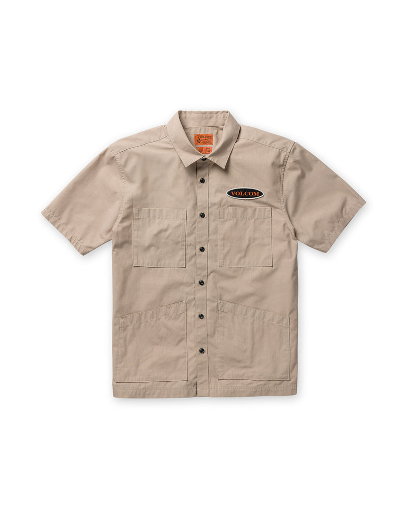 Volcom Men’s Driggs Workwear Short Sleeve in tan, featuring a classic fit, two chest pockets, two lower front pockets, and an oval logo patch.