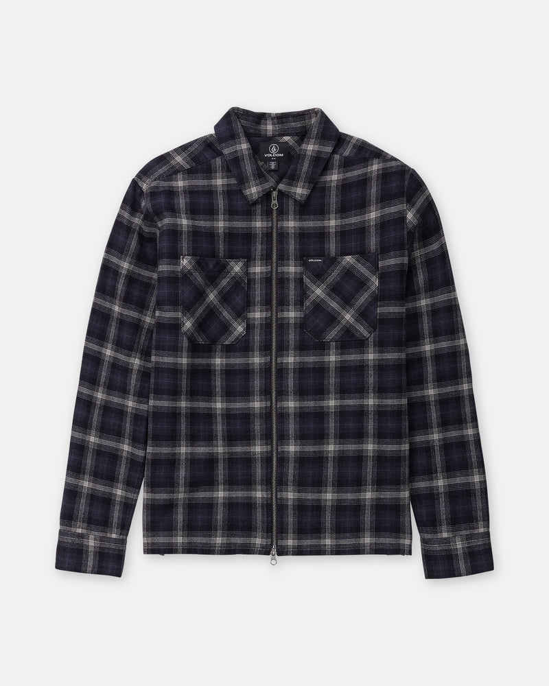 Volcom Men’s Fieldstone Long Sleeve heavyweight flannel shirt in a dark navy and grey plaid pattern, featuring a zip-front, long sleeves, and two chest pockets in a modern boxy fit.