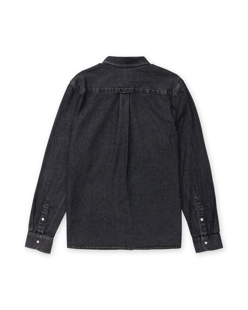 Back view of a black midweight Volcom Men’s Goodwin Long Sleeve denim shirt in a relaxed fit, featuring a back yoke, central pleat, and button cuffs.