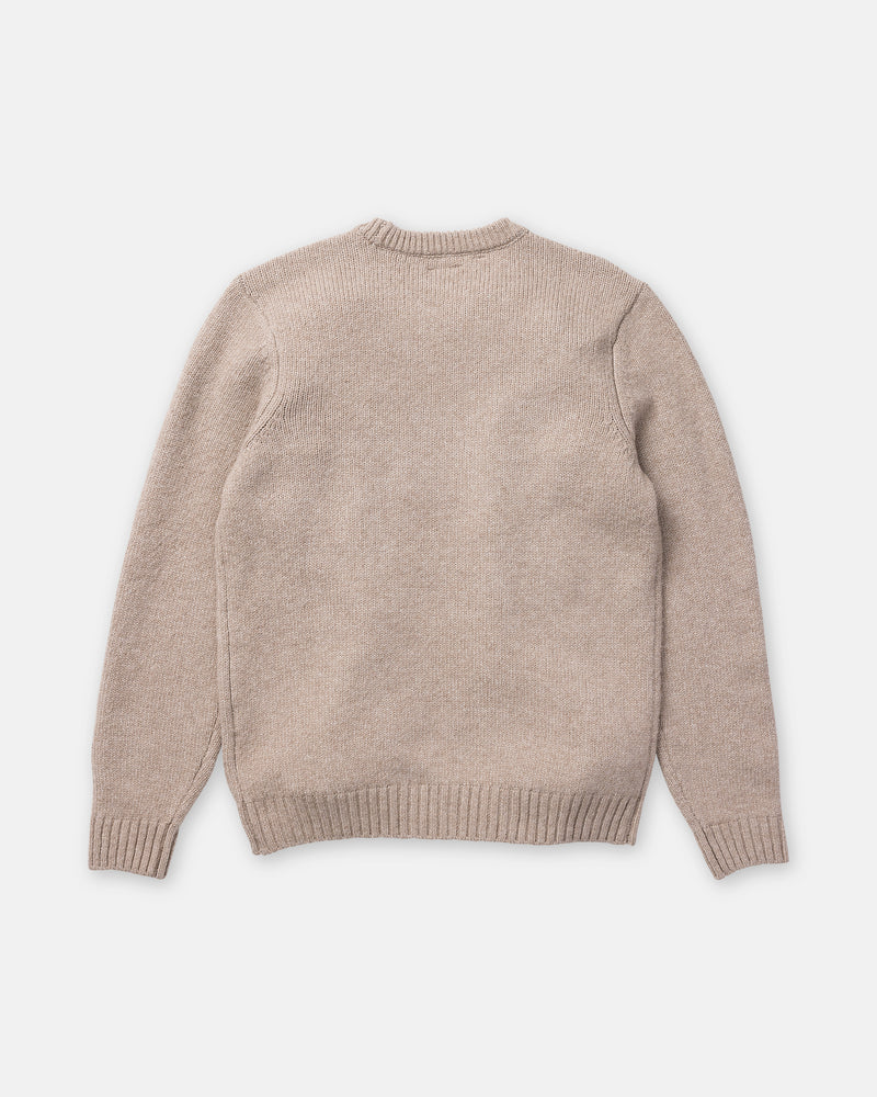 A beige Volcom Men’s Edmonder II Sweater is displayed from the back, featuring long sleeves, ribbed cuffs, and a ribbed waistband. Crafted from a recycled-poly blend, it is laid flat on a plain white background.