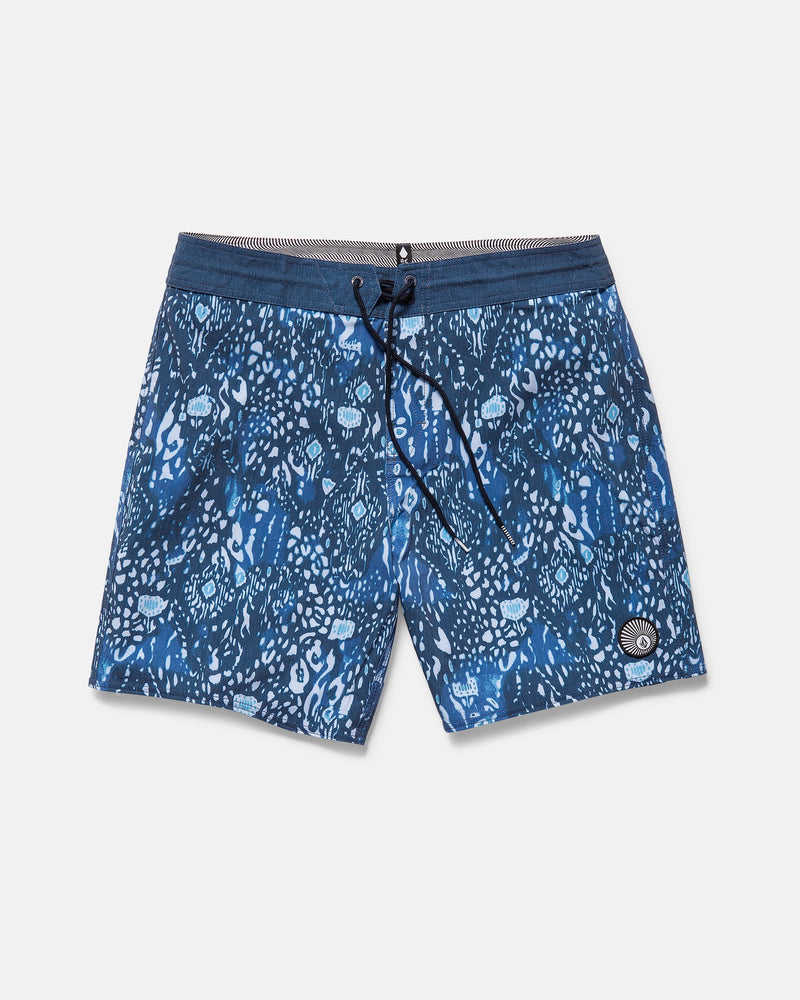 Volcom Men's Psyche Cotton 17" Trunk boardshorts feature a drawstring waist, abstract blue and white pattern, Stoney Cinch Fly Technology, and a small circular patch on the lower left leg. Shown laid flat on a white background.