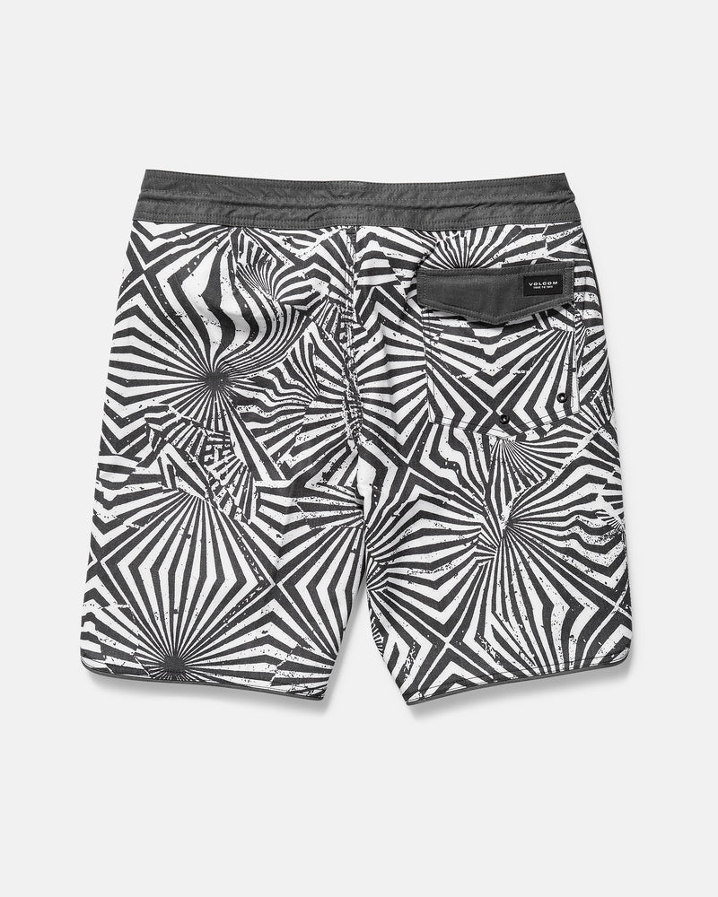 Black and white patterned shorts on a gray background