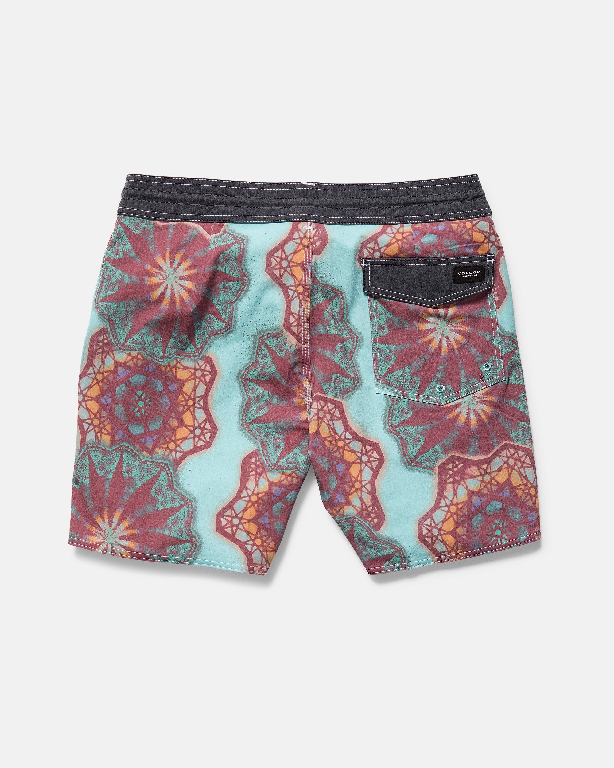 Back view of Volcom Men's Star Shields Featured Artist Pcs Stoney, featuring a vibrant geometric mandala in red, orange, and teal on light blue, with an aquatic-ready design and a black back pocket with flap and button closure.