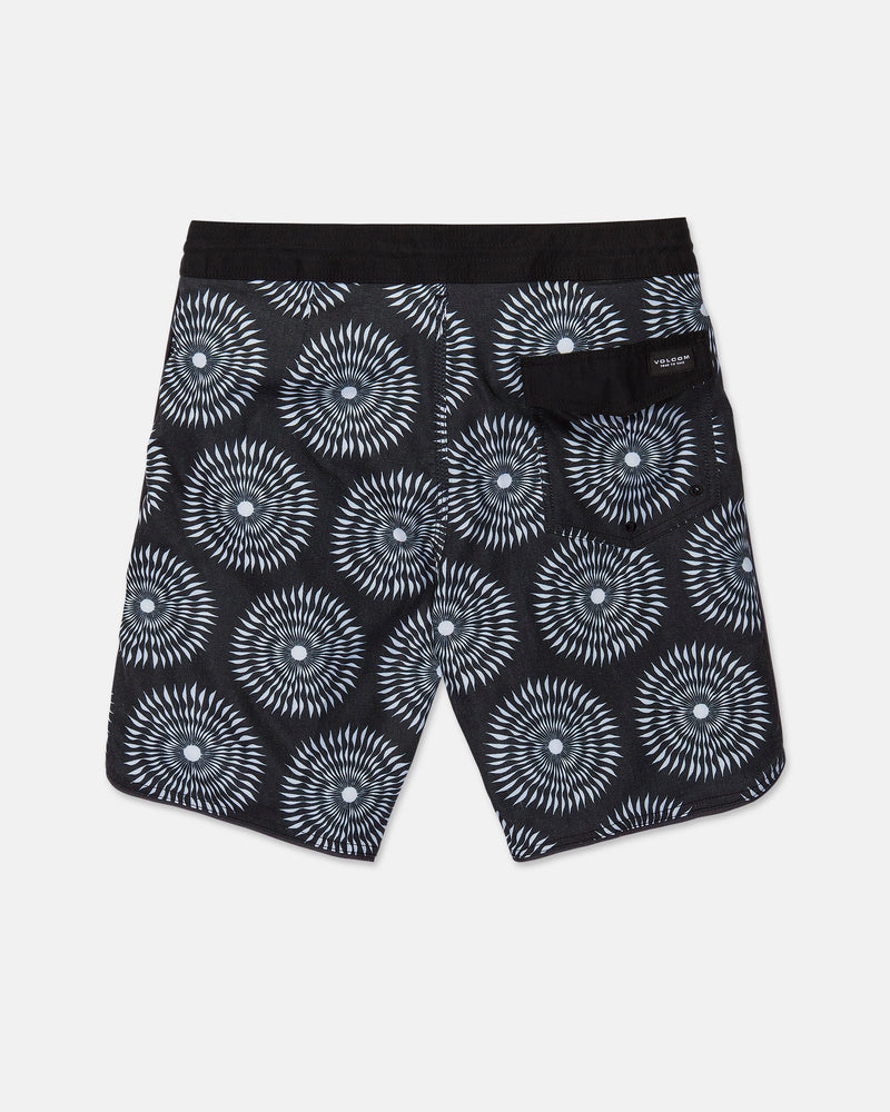 The Men's Barnacle Stoney shorts by Volcom feature a black base with a white geometric circular pattern, a solid black waistband, and a back pocket adorned with a small label. Expertly crafted from a durable hemp-cotton blend, these shorts are displayed laid flat against a white background.