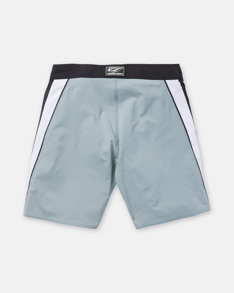 The Volcom Men’s Facet Mod 20 boardshorts are shown from the back on a plain white background, featuring a light blue color with a black waistband and white side panels. Crafted with 4-way stretch fabric, they offer ultimate comfort and mobility.