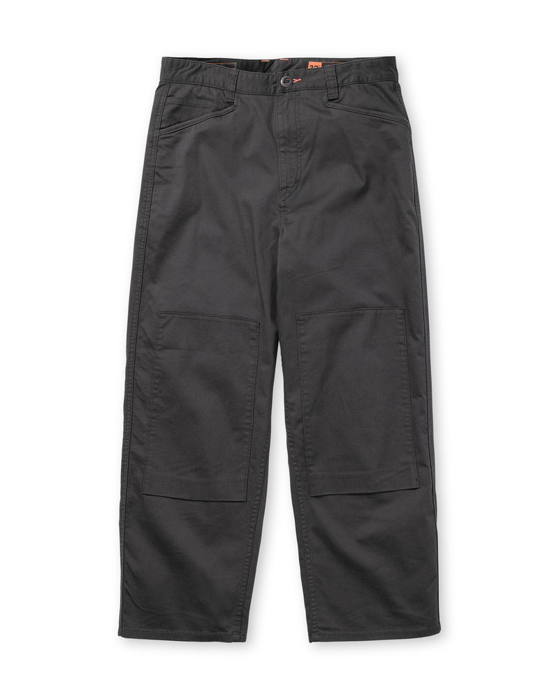 Volcom Men’s Stoneworks Utility Work Pant in black, featuring a loose fit with an elastic waistband, belt loops, straight legs, reinforced front-leg patches for durability, and utility cargo styling with front and large knee pockets; shown laid flat on a white background.