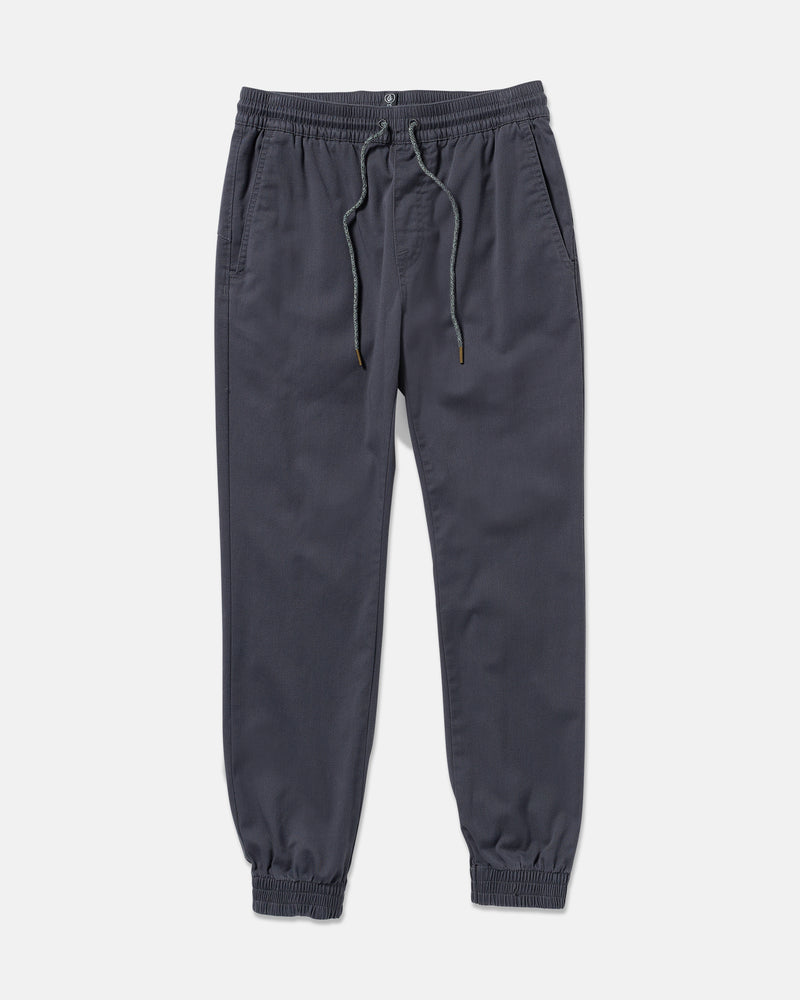 The Volcom Men's Frickin Slim Joggers in dark gray feature REPREVE recycled fibers, an elastic waistband with drawstring, side pockets, and elastic cuffs, shown laid flat on a white background.