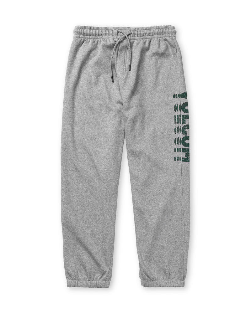 Light gray Men’s Quadratic Fleece Pant by Volcom with classic fit, elastic waistband, drawstring, ankle cuffs, and “Vuitton” printed vertically in dark green on the left leg.