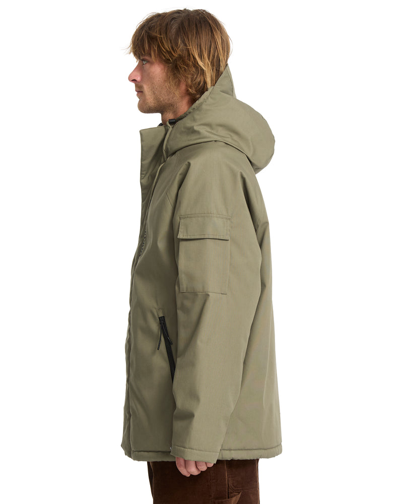 Side view of a man wearing a Men’s Stoke Stone II 10K Jacket in olive green, featuring a hood, a flap pocket on the left sleeve, and zippered hand pockets.