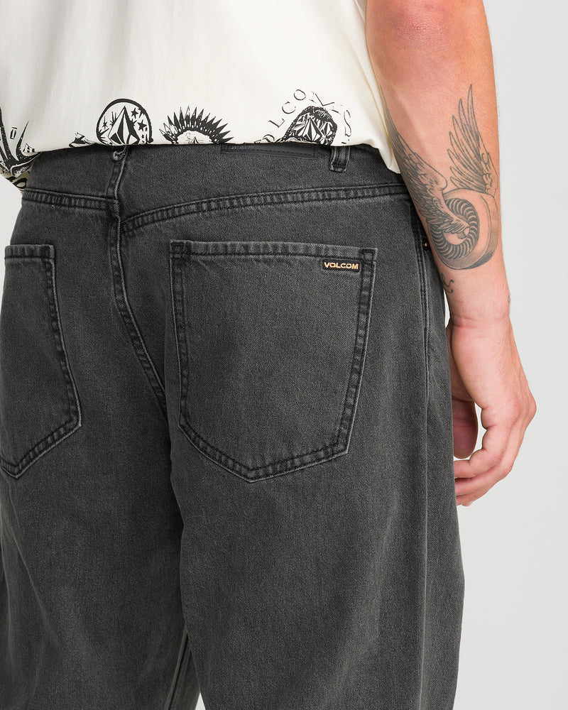 Back view of Men’s Pipe Dreams Denim relaxed straight fit charcoal jeans featuring two back pockets and a small Volcom logo tag on the right pocket.