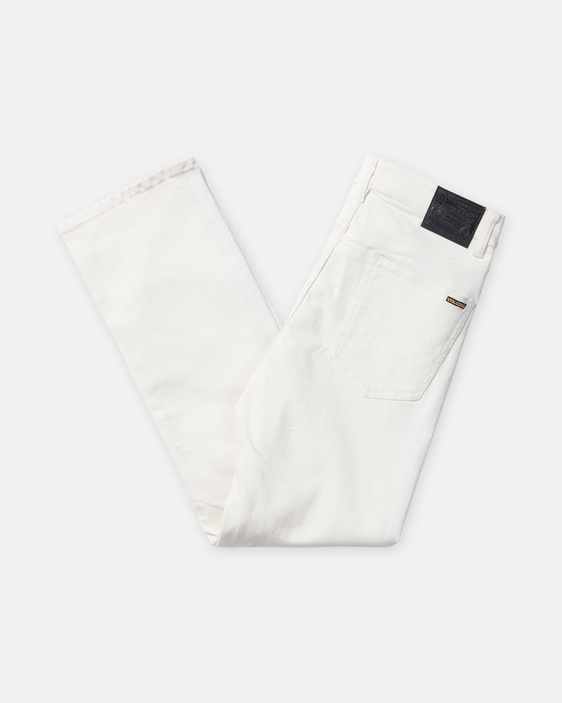 Off-white straight leg Men’s Solver Denim jeans featuring five-pocket styling and a black leather Volcom brand patch on the back waistband.