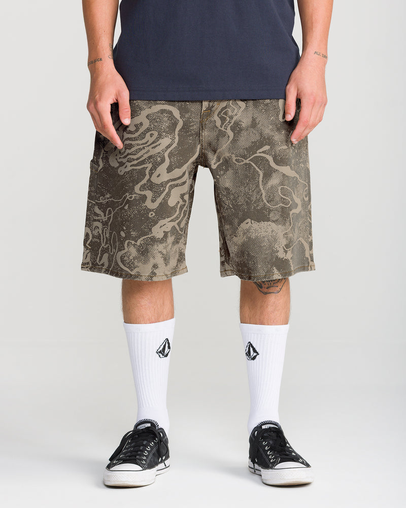 Men’s Kinkade Utility Denim Short 22 in olive green with a dark brown abstract topographic print, worn with white crew socks and black sneakers.