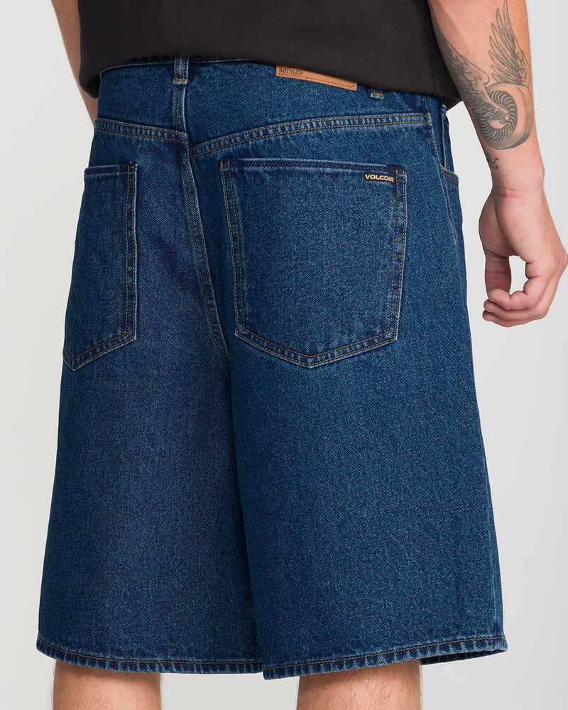 Back view of loose-fitting indigo Men’s Billow Denim Short 22 with two back pockets.