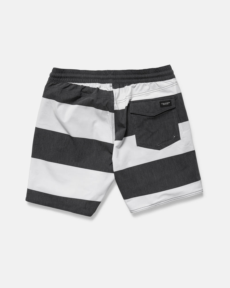 Back view of Volcom Men's Psyche Cotton 17" Trunk in black and white horizontal stripes, featuring a 17-inch outseam, elastic waistband, and a single flap back pocket on the right.