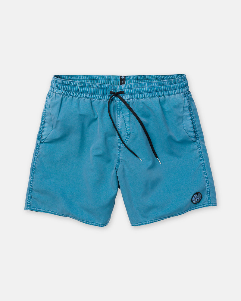 The Volcom Men’s Center Trunk 17 is a pair of bright blue stretch swim trunks featuring an elastic waistband with a black drawstring, convenient side pockets, and a small round logo patch near the front hem. This 17-inch outseam trunk style is shown laid flat on a white background.