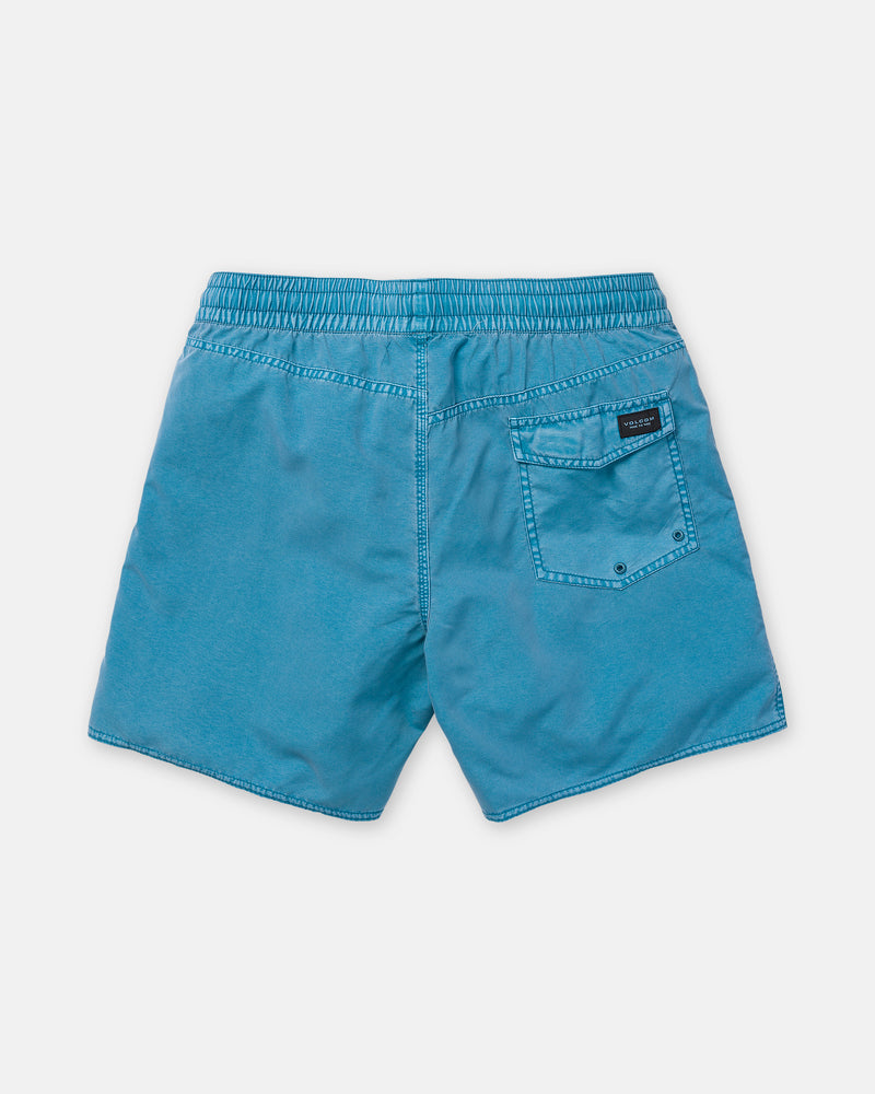 The Volcom Men’s Center Trunk 17 swim shorts are shown flat on a white background, highlighting the back view. These light blue men’s stretch trunks feature an elastic waistband, visible stitching, and a single right-side back pocket detailed with a black Volcom label. With a 17-inch outseam, they offer both comfort and style for swimming.