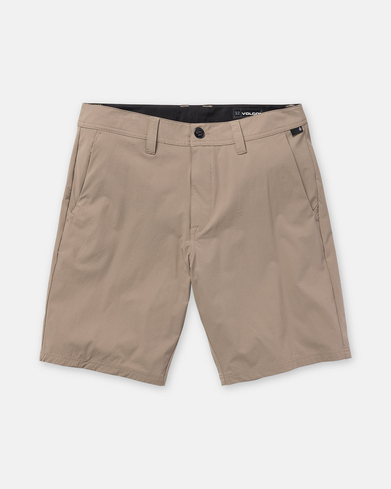 The Volcom Men’s Frickin Cross Shred 20 shorts, in light brown khaki stretch fabric, feature belt loops, a front button and zipper closure, and two side pockets, shown against a plain white background.