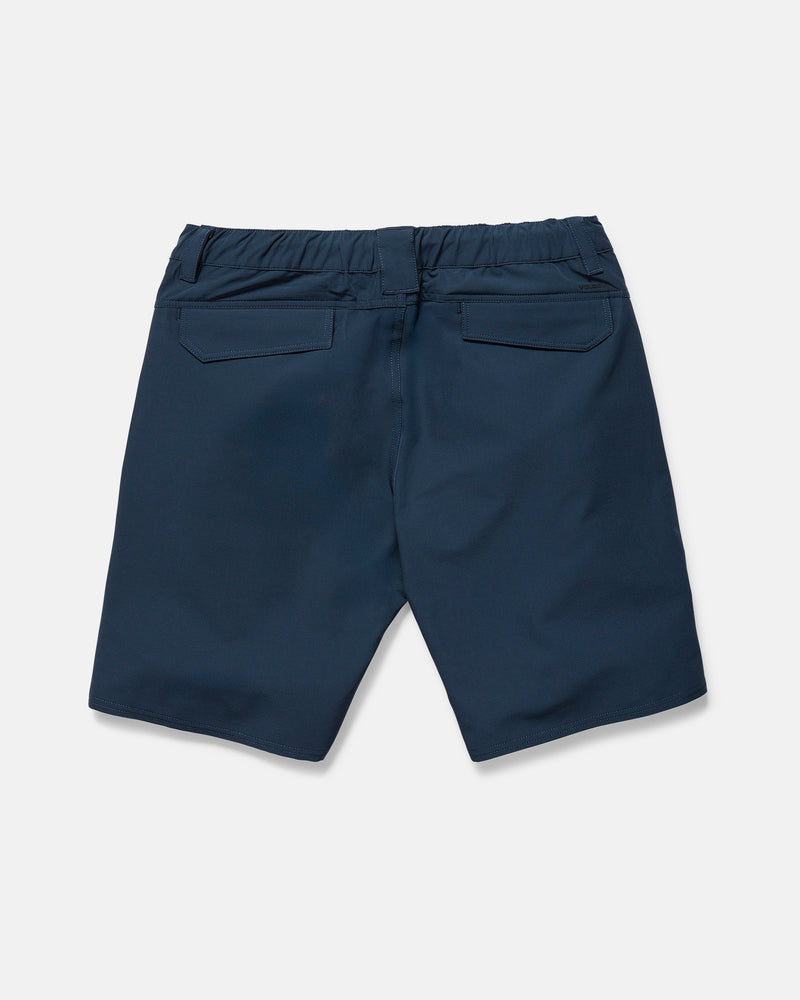 The Volcom Men's Harbor Hybrid Shorts in navy blue are shown from the back, laid flat on a white background. They feature an elastic waistband, two back flap pockets, and a 20-inch outseam.