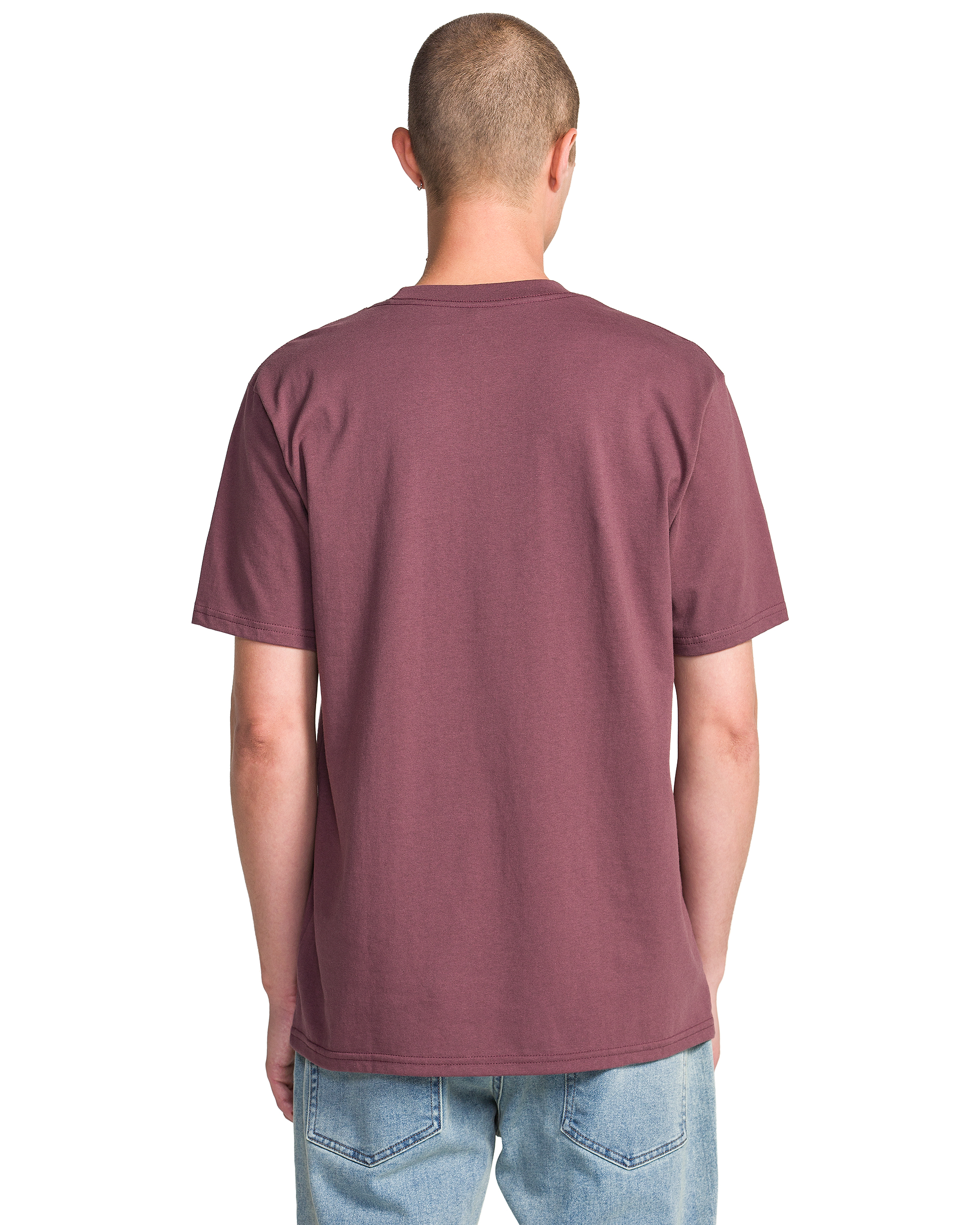 A person with short hair, seen from behind, wears a Volcom Men's Live Wire Short Sleeve Tee in maroon and light blue jeans, set against a white background.