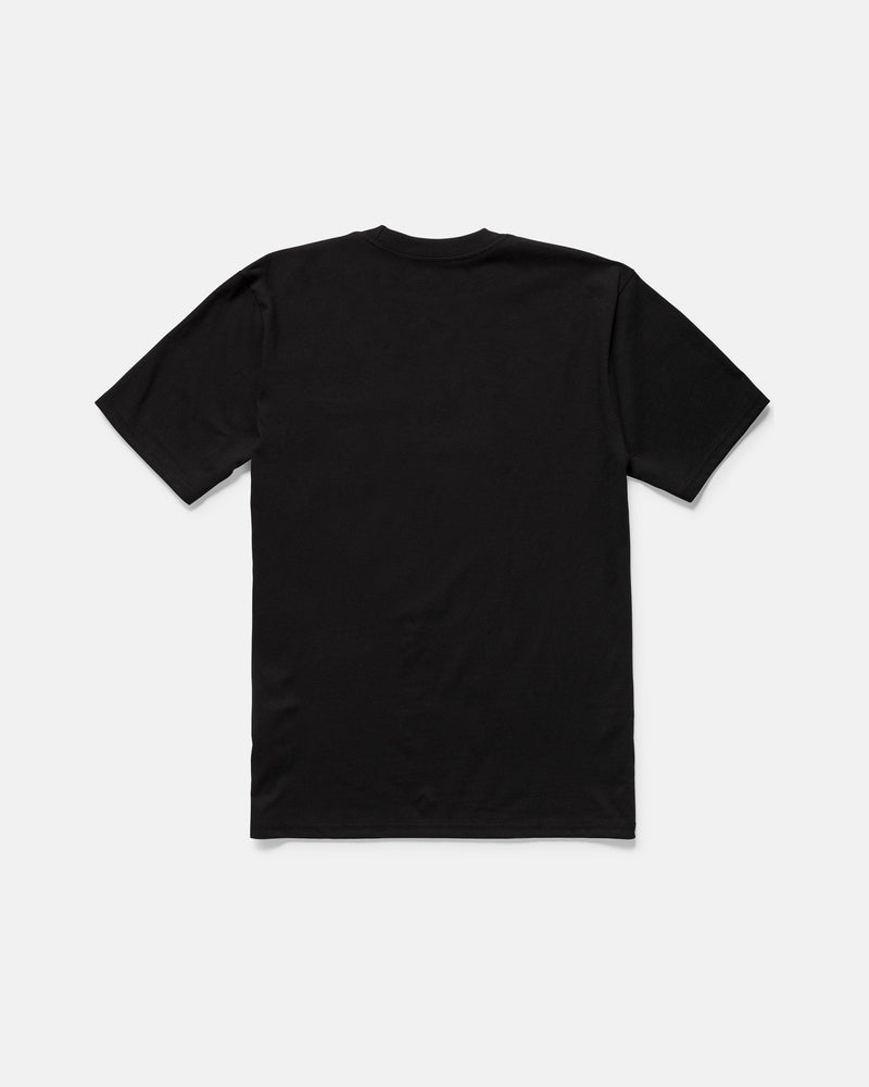 The Volcom Men’s Workwear Certifico Short Sleeve Tee is displayed from the back, laid flat on a light gray background. Made from premium cotton for everyday comfort, this classic fit tee features a minimalist design with a subtle woven label patch for added detail.